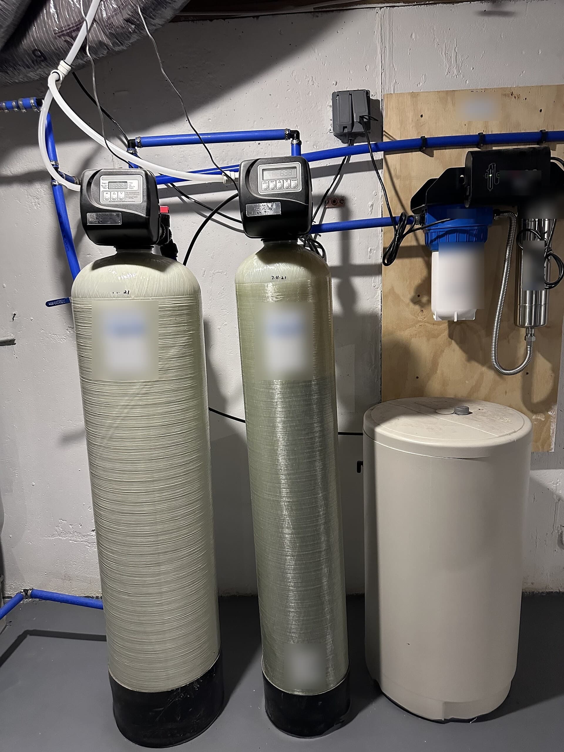 A residential whole-house water filtration equipment installation